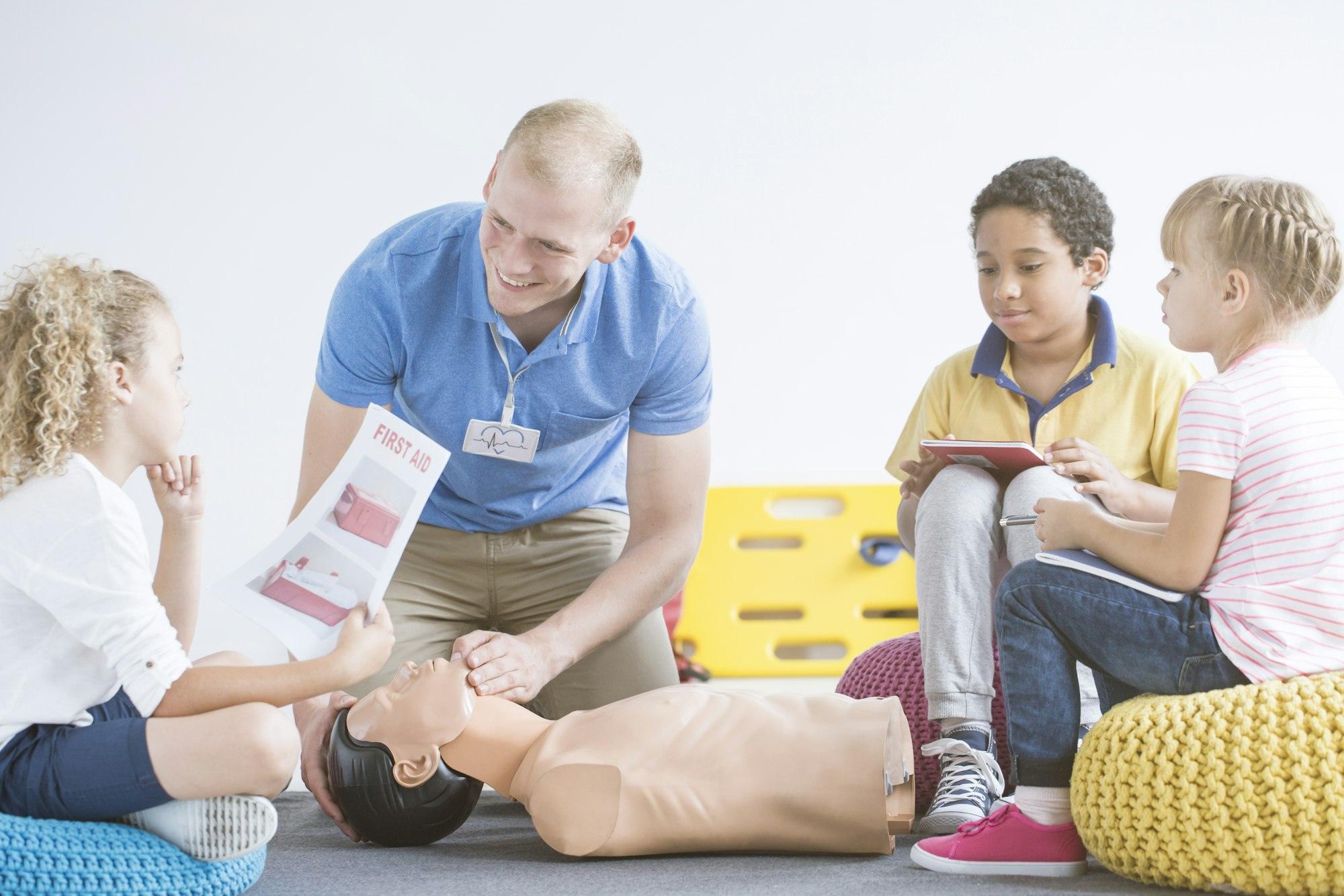 Boy with first aid instruction