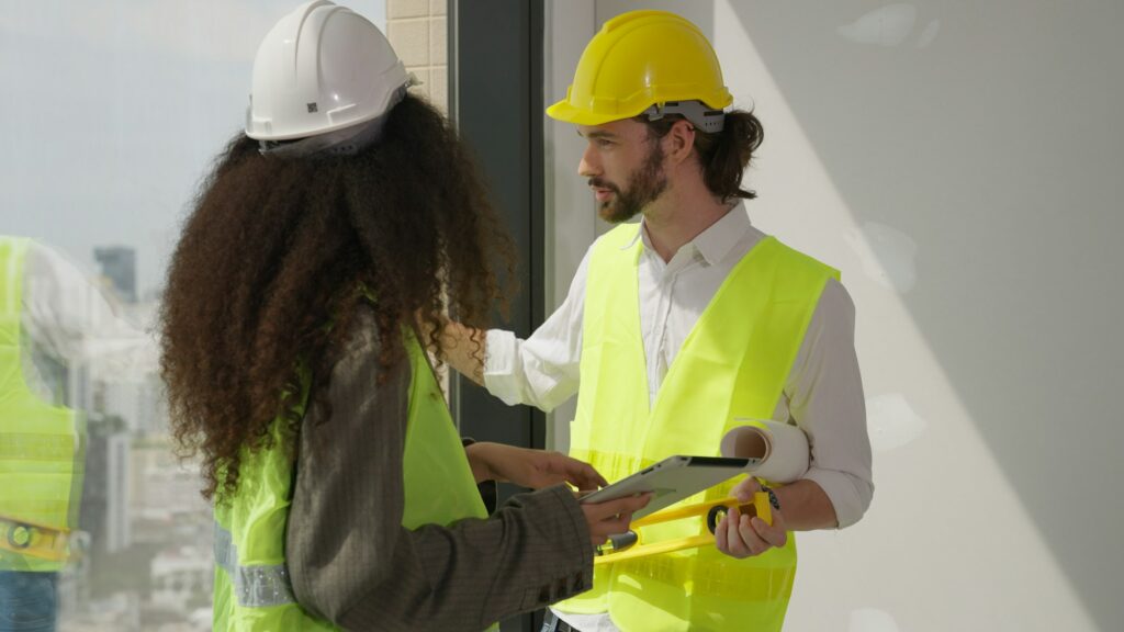 Couple of professional architects workers using tablet brainstorming