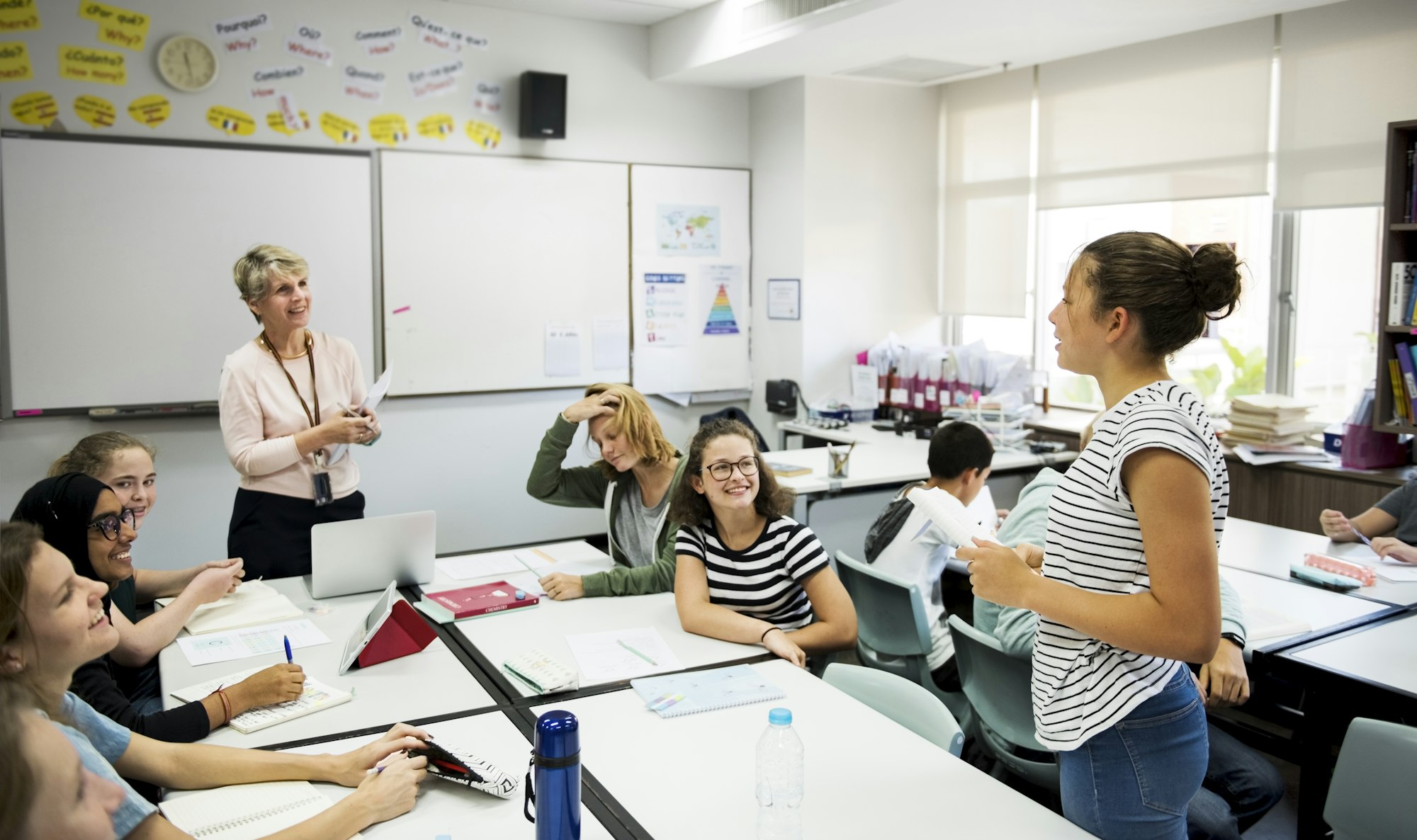 Group of students learning in classroom